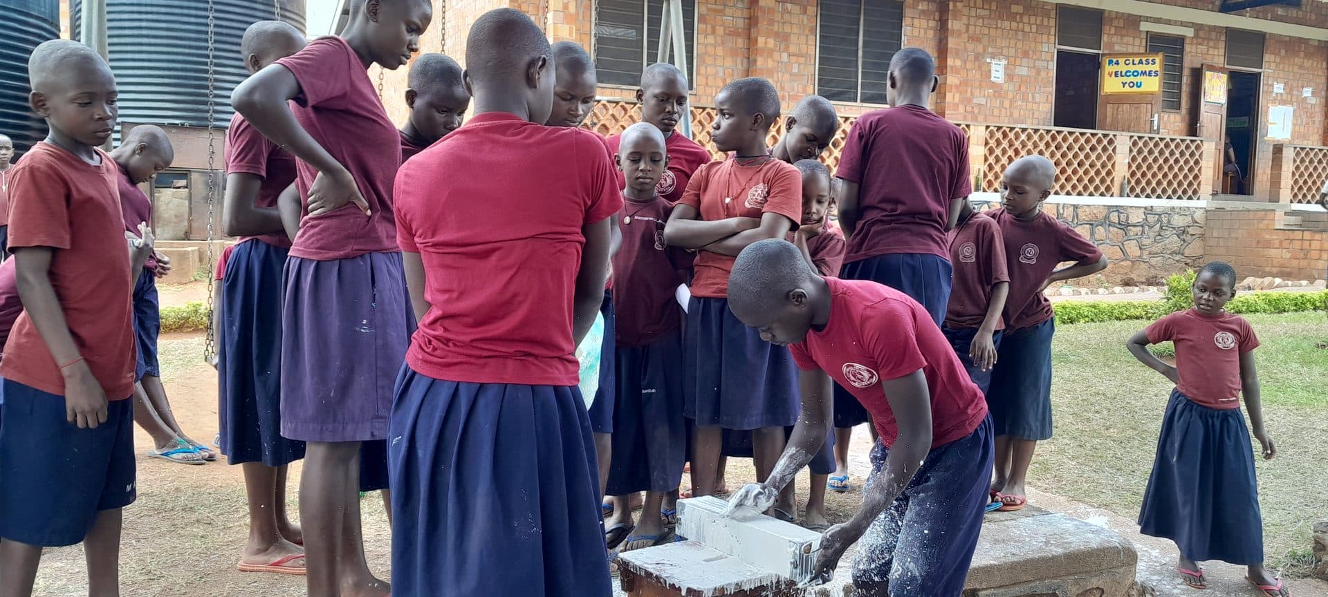Learners making chalk sticks on campus