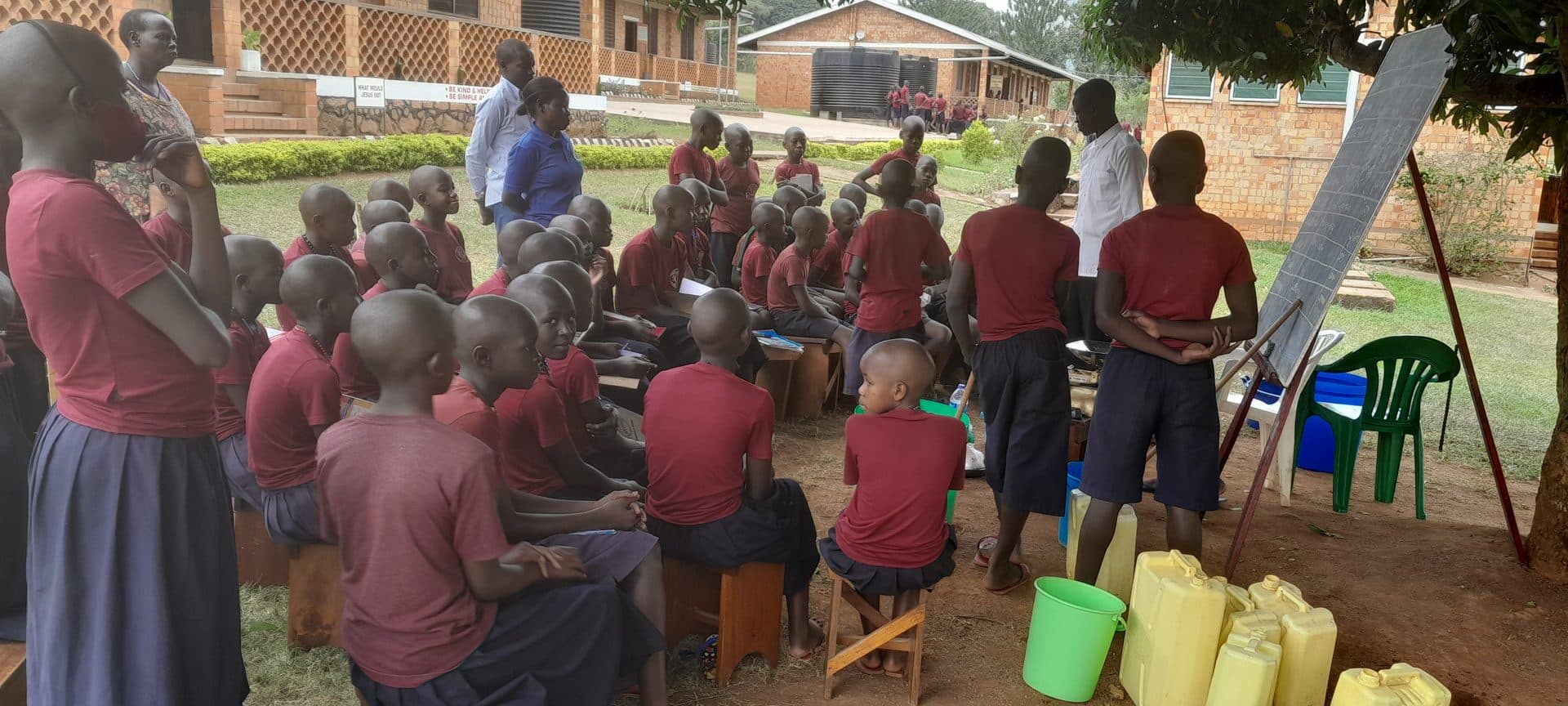 Learners gathered for an outdoor lesson at St. Julie Model