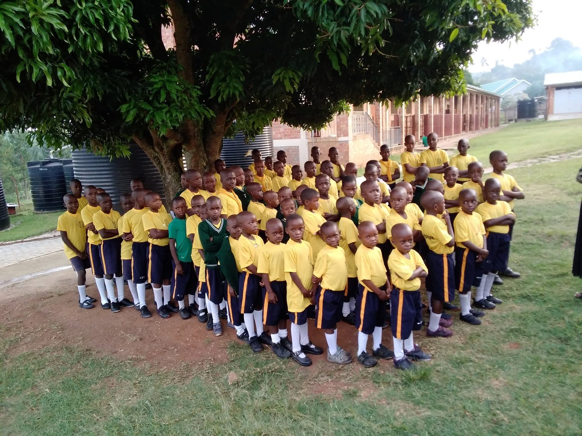 Boarders lined up in front of the dormitories at St. Julie Model