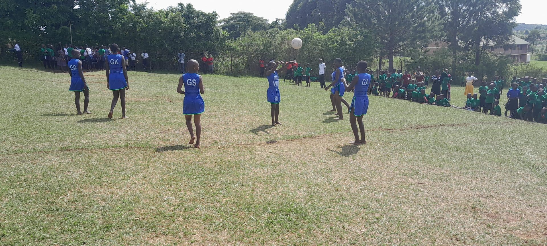 Learners playing netball on the school field
