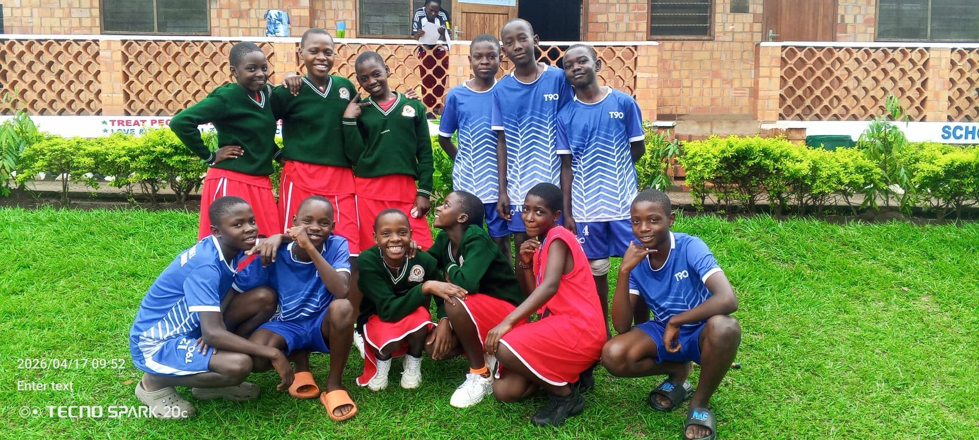 St. Julie Model netball and football teams outside the library